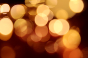Abstract dark red and golden bokeh background holiday texture