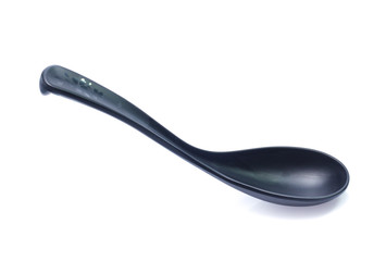 plastic black spoon, isolated on white background