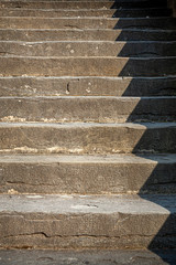 Stone stairs with shadow creating a patterni