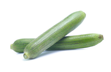 fresh green sponge gourd or luffa with slice isolated on white background
