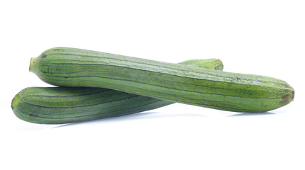 fresh green sponge gourd or luffa with slice isolated on white background
