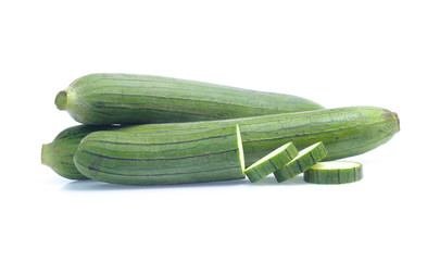fresh green sponge gourd or luffa with slice isolated on white background