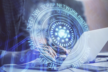 Businessman with computer background with technology theme hologram. Concept of big data. Double exposure.