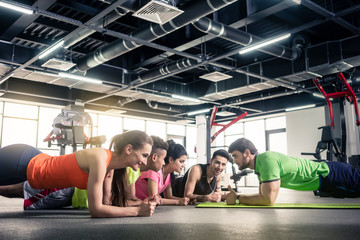 Trainer giving training at gym