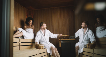People enjoying sauna health benefits and relax