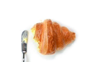 Croissant with butter on white background - isolated