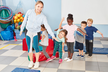 Group of children and sports teacher