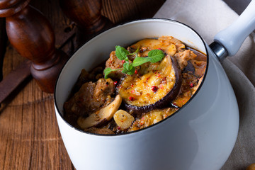 Veal goulash with baked aubergine and herbs