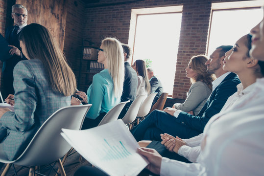 Side Profile Close Up View Photo Of Serious Attentive Smart Large Crowd Listening To Chief Ceo Boss Employer Financier Banker Convention Sit On Chair Seats In Modern Loft Interior Near Window