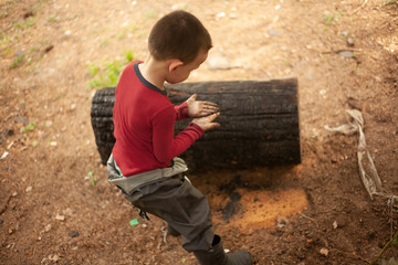 The baby is playing. Difficult and uncontrollable boy. Hyperactivity in children. Fidget child ran...