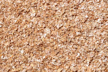 Background texture of crushed seed and grain mix for livestock and bird feed