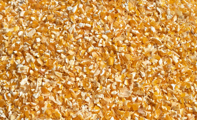 Background texture of crushed seed and grain mix for livestock and bird feed