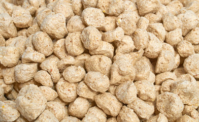 Background texture of crushed seed and grain mix for livestock and bird feed