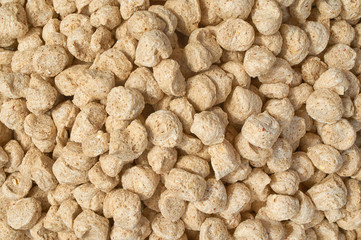 Background texture of crushed seed and grain mix for livestock and bird feed
