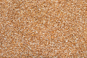 Background texture of crushed seed and grain mix for livestock and bird feed