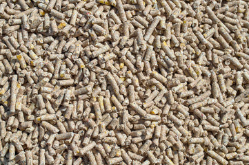 Background texture of crushed seed and grain mix for livestock and bird feed