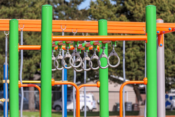 Climbing structures - monkey bars and monkey rings on a school playground.