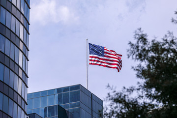 Fototapeta premium American flag on the top of a building