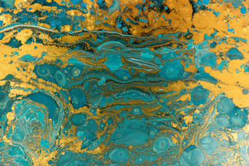 Blue and gold marbling pattern. Golden powder marble liquid texture.