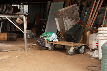 The child plays in the workshop. Difficult and uncontrollable boy. Hyperactivity in children. The...