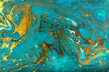 Fototapeta na wymiar Blue and gold marbling pattern. Golden powder marble liquid texture.