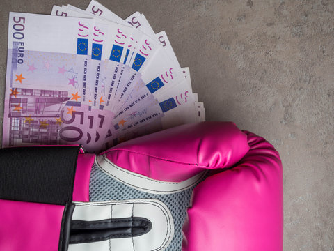 boxing for money, boxing glove with cash, Concept of bribery, dishonesty in sport, greed. Copy space