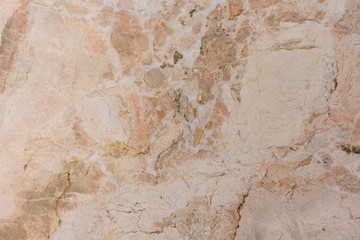 marble tiles with stains of different colors and sizes with cracks from old age