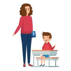 happy student boy in schooldesk with female teacher