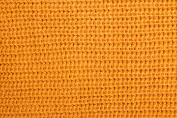 Woolen knitted texture of bright yellow color
