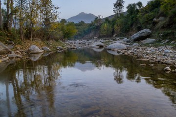 Autumn trees reflections in a lake