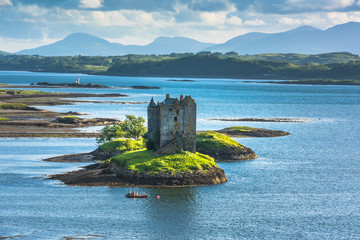 Castle on island - Castle Stalker - a picturesque castle surrounded by water located 25 miles north...