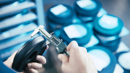 Measuring rubber product thickness