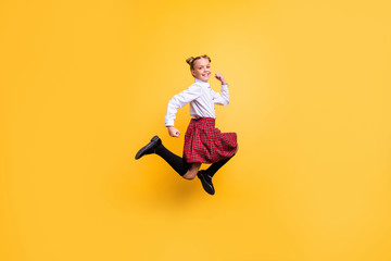 Fototapeta na wymiar Full length body size view of her she nice lovely attractive cheerful cheery positive careless pre-teen girl having fun time isolated over bright vivid shine yellow background