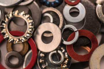 Divers industrial washers and rings. Various colorful washers rings on white background Screw washer.