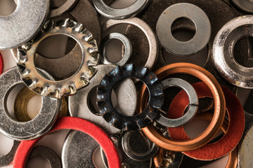 Divers industrial washers and rings. Various colorful washers rings on white background Screw washer.