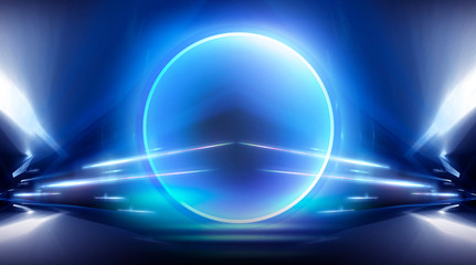 Neon circle, wet asphalt, reflection. Neon circle with the center of a dark empty scene with spotlights. Abstract light. Lights of the night city, abstract light