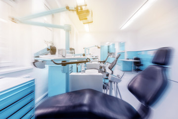 dental clinic interior with dentist chair and modern blue dentistry equipment  -