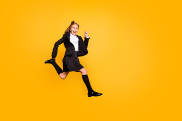 Fototapeta na wymiar Full length photo of funny kid running activity laughing screaming shouting isolated over yellow background