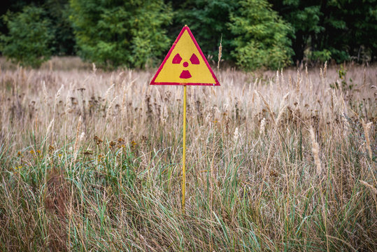 Radiation sign in Red Forest near power plant in Chernobyl Exclusion Zone, Ukraine