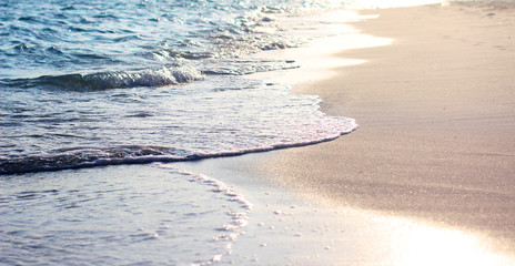 sea ​​waves on the beach at sunset