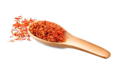Safflower dried in wood spoon on white background