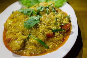 green parsley on fried crab curry background, close up shot