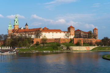 Krakow, Poland - April, 2019: Wawel castle famous landmark in Krakow Poland. Picturesque landscape on coast river Wisla.