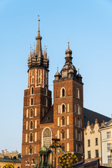 Krakow, Poland - April, 2019: Church of St. Mary and the Cloth Hall on the main market square in Krakow
