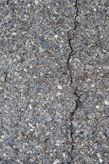 Cracks on a gray-black concrete floor