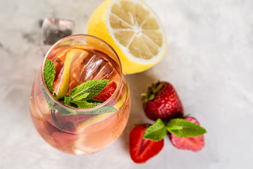 Selection of sangrias - red, pink, white and ingredients, rustic background