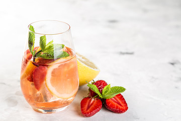 Selection of sangrias - red, pink, white and ingredients, rustic background