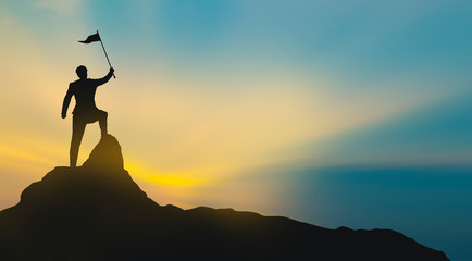 silhouette of man on mountain top over sky and sun light background,business, success, leadership,...