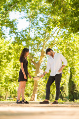 Obraz premium Portrait of a young couple in love enjoying in a city park