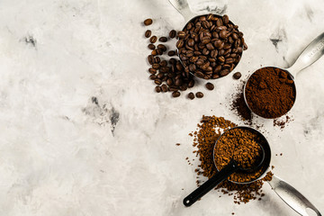 Coffee concept - beans, ground, instant, capsules marble background top view